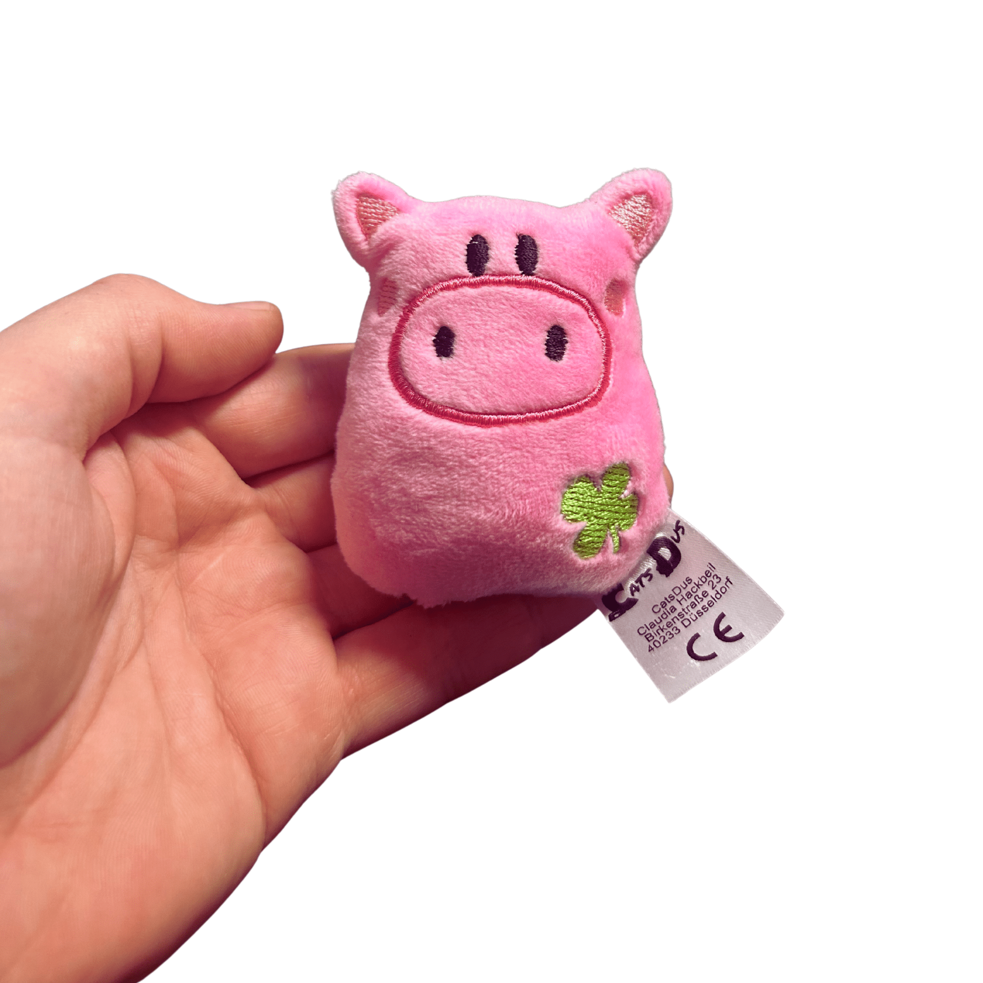 Glücksschwein aus Microfaserplüsch in Handgröße mit grüner Kleeblattstickerei.