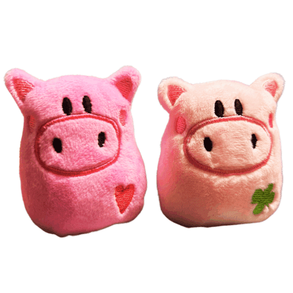 Glücksschwein aus Microfaserplüsch in Rosa mit Herz und in hellrosa mit Kleeblatt.